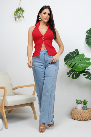 Bulla sleeveless knit top with a double-open zipper that can be zipped from both the top and bottom. it features a high collar that can be worn fully zipped up or opened down for a more relaxed look.