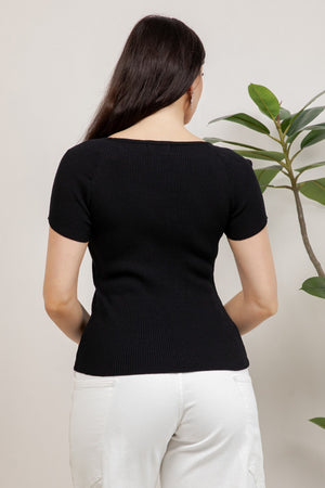 Ribbed short sleeve knit top with v-neckline and ornamental metal button details.
