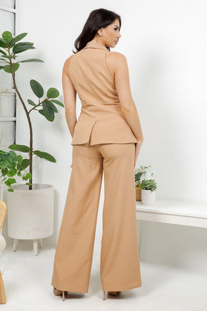 Teste is a chic three-piece tailored set featuring a sleeveless lapel vest, high-waist wide leg pants, and a matching sleeveless top.