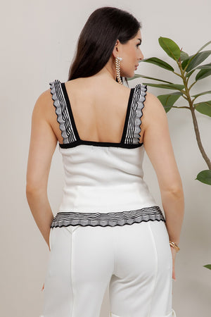 Bimba Chic knitted top with ribbed floral-gold buttons and ruffled straps and hem