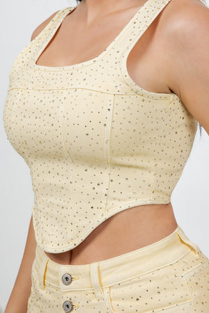 Denim corset embellished with tonal rhinestones all around, featuring a back zipper.