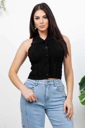 Lotas a knit top featuring large tone-on-tone buttons and textured side details. designed with a versatile neckline