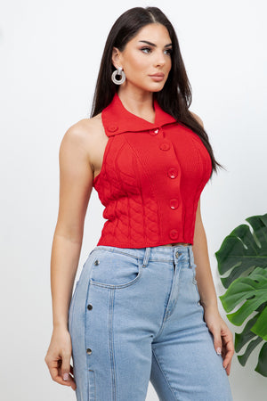 Lotas a knit top featuring large tone-on-tone buttons and textured side details. designed with a versatile neckline