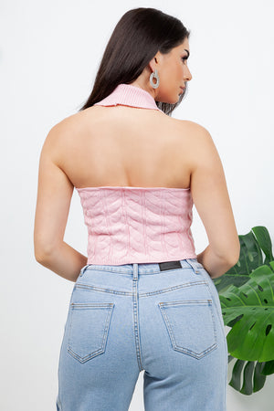 Lotas a knit top featuring large tone-on-tone buttons and textured side details. designed with a versatile neckline