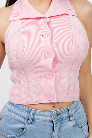 Lotas a knit top featuring large tone-on-tone buttons and textured side details. designed with a versatile neckline